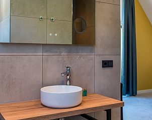 Sauna in Holiday cottage in Den Burg, Texel, with wooden interior and glass door.