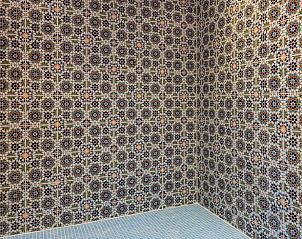 Door to steam room in Holiday cottage in Den Burg, Texel, with colorful tiling.