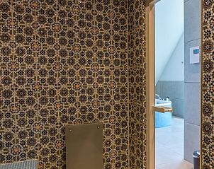 Jacuzzi with TV in Holiday home in Den Burg, Texel, for ultimate relaxation.