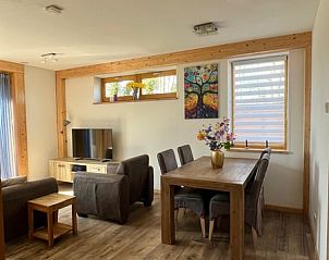 Dining area and living room in Hoeve Consensus Texel vacation home, Den Burg, ideal for family gatherings