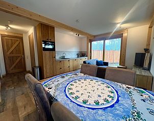 Modern kitchen and dining area in Hoeve Consensus Texel vacation home in Den Burg