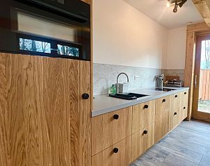 Stylish wooden kitchen in Hoeve Consensus Texel vacation home, Den Burg, Texel