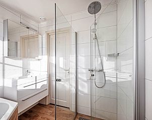 Modern shower in Waddenduyn vacation home, Den Burg, Texel with glass wall.