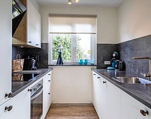 Fully equipped kitchen in Cottage in Den Burg, Texel, vacation home with modern amenities.