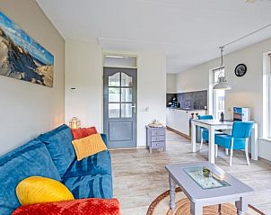 Bright living room in Cottage in Den Burg, Texel, vacation home with open kitchen and dining area.