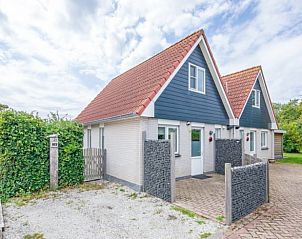 Terrace with garden furniture at Cottage in Den Burg, Texel, vacation home ideal for outdoor living.