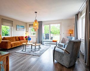 Cozy living room in Holiday home in Den Burg, Texel, overlooking the garden.