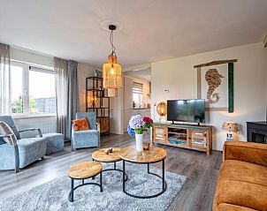 Stylish living room with television in Holiday home in Den Burg, Texel, Wadden Islands.