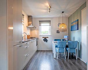 Cozy kitchen and dining room in Holiday home in Den Burg, Texel, with lots of light.