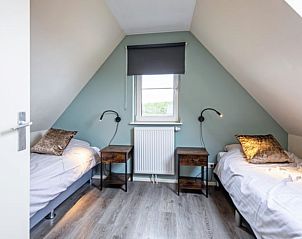 Bedroom with single bed in Holiday home in Den Burg, Texel, with skylight.