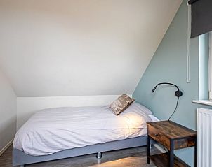 Spacious double bedroom in Holiday cottage in Den Burg, Texel, with natural light.