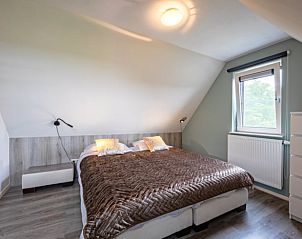 Cozy bedroom with double bed in Holiday home in Den Burg, Texel.