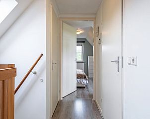 Bathroom with bath and washing machine in Holiday cottage in Den Burg, Texel, Wadden Islands.