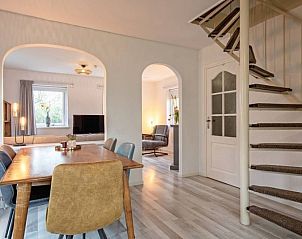 Spacious dining and living room in Holiday home 5 Persoons Den Burg Texel with stylish furnishings.