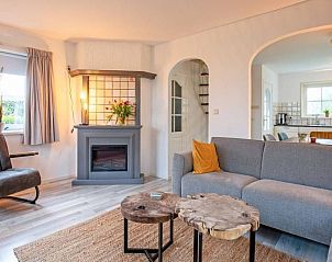Comfortable living room in Holiday home 5 Persoons Den Burg Texel with fireplace.