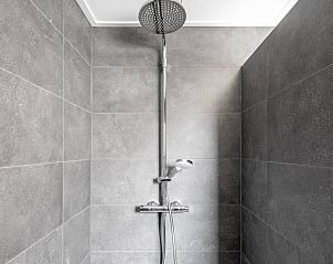 Modern shower in Holiday home 5 Persoons Den Burg Texel for ultimate comfort.