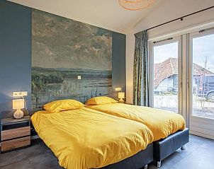 Attractive bedroom in Holiday home 5 Persoons Den Burg Texel with a view of the surroundings.