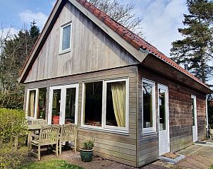 Terrace of The Achterhuys vacation home in Den Burg, Texel surrounded by nature.
