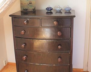 Antique chest of drawers in Het Achterhuys vacation home in Den Burg, Texel.