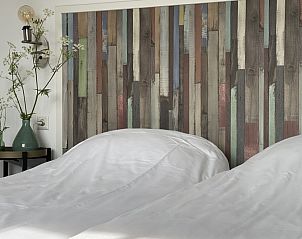 Sfeervolle slaapkamer in Villa Nieuw Leven Texel, vakantiehuis in Den Burg, Texel.