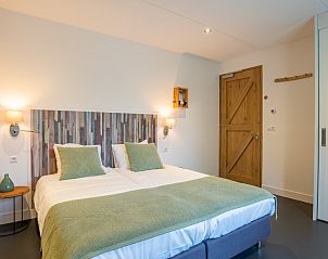 Comfortabele slaapkamer in Villa Nieuw Leven Texel, vakantiehuis in Den Burg, Texel.