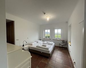 Bedroom with a view in 44 - Aldubo Landhuis, Den Burg, Texel, with comfortable beds.