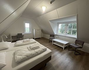 Bright bedroom in 44 - Aldubo Landhuis, Den Burg, Texel, overlooking nature.