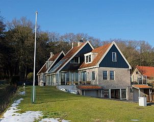 Exterior of 44 - Aldubo Landhuis, Den Burg, Texel, with large windows and modern design.