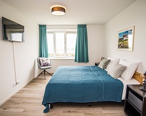 Comfortabele slaapkamer in Onder de Wol Den Burg, Texel met prachtig uitzicht.