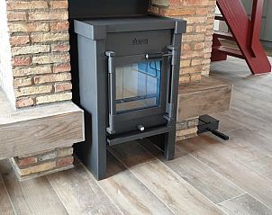 Houtkachel in het vakantiehuis 't Wambuis, Den Hoorn, Texel voor een warme en knusse ambiance.