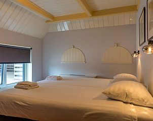 Komfortables Schlafzimmer im Ferienhaus in Oosterend, Texel, mit Doppelbett und weicher Bettwsche.