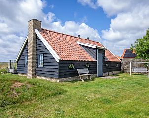 ZoWad - Mhlenhaus Beaufort, Ferienhaus in Oosterend Texel mit traditioneller Fassade und grnem Garten.