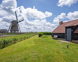 Blick auf die Windmhle und ZoWad - Mhlenhaus Beaufort, Ferienhaus in Oosterend Texel, umgeben von Natur.