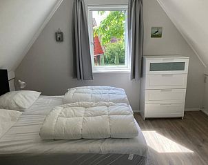 Helles Schlafzimmer mit Aussicht in Typ I - Nr. 89 Lark Ferienhaus Oosterend Texel.