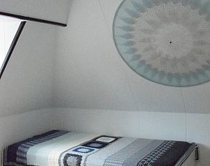 Extra bed in slaapkamer van 't Achterhuis vakantiehuis Oudeschild Texel.