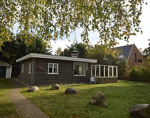 Vacation home De Nagtegaal 15 in De Dennen, Texel with spacious garden and cozy veranda.