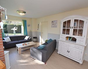 Comfortable sitting area in Holiday Home De Nagtegaal 15, Texel, ideal for relaxation.