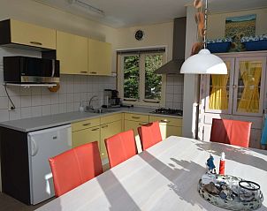 Modern kitchen in Holiday home De Nagtegaal 15, De Dennen, Texel with spacious dining area.