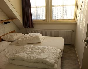 Gemtliches Schlafzimmer im Ferienhaus Duif, De Dennen, Texel, fr einen entspannten Aufenthalt auf den Watteninseln.