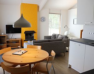 Dining room and kitchen in Holiday home Gortersmient 330, De Dennen, Texel with modern furnishings.