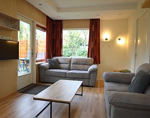 Comfortable sitting area in Holiday home De Nagtegaal 19, De Dennen, Texel, ideal for relaxation.