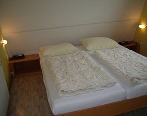 Comfortable bedroom in Holiday home Gortersmient 356, De Dennen, Texel. Restful sleep on the beautiful Wadden Islands.