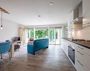 Spacious kitchen in Bungalowpark Uterste Coogh - Bungalow 82 - De Luwte, De Dennen, Texel with modern appliances.