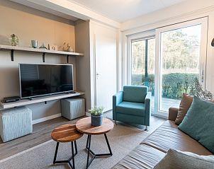 Bright living room with flat-screen TV in Apartment Bos en Duin 12, De Dennen, Texel, ideal for relaxation.