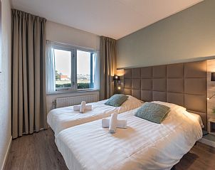 Attractive bedroom with double bed in Apartment Bos en Duin 12, Texel, for a good night's sleep.