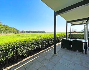 Panoramic view from the terrace of Apartment Bos en Duin 12, De Dennen, Texel, showing vast fields.