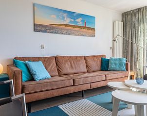 Stilvolles Wohnzimmer im Bungalowpark De Parel - WELMOED auf Texel, perfekt fr einen entspannten Aufenthalt.