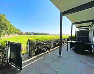 Uitzicht vanaf het terras van Appartement Bos en Duin 14, De Dennen, Texel over de Texelse natuur.