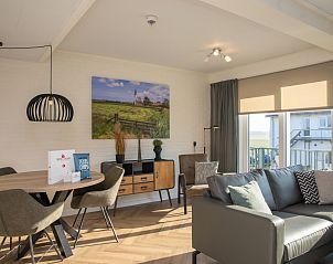 Cozy living room of Apartment Bos en Duin 28 in De Dennen, Texel, with comfortable seating area and views of nature.