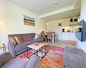 Open kitchen and dining area in Apartment Bos en Duin 31, Texel, Wadden Islands with cozy sitting area.